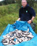Darren Hurst braved the high winds and rain for this good catch of Roach.